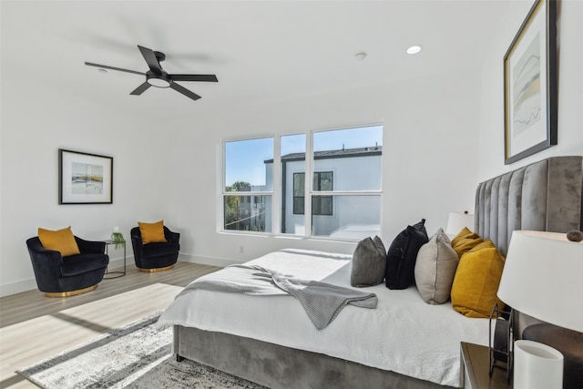 bedroom featuring ceiling fan and light hardwood / wood-style floors