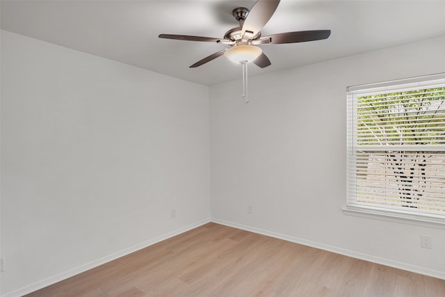 spare room with ceiling fan and light hardwood / wood-style flooring