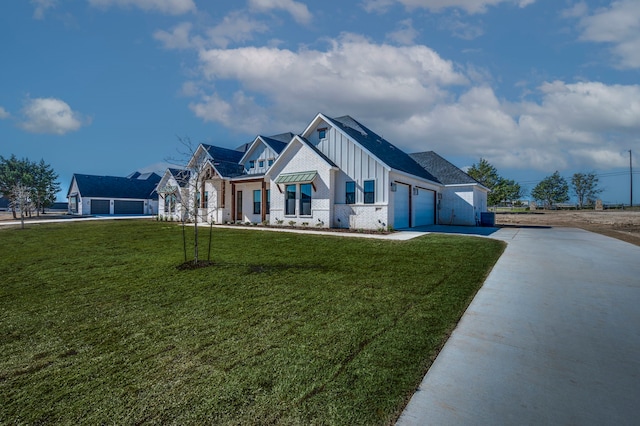 modern farmhouse with an attached garage, board and batten siding, driveway, and a front lawn