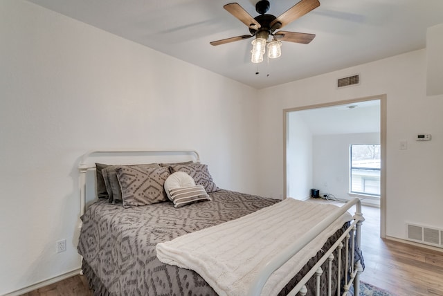 bedroom featuring ceiling fan and hardwood / wood-style flooring