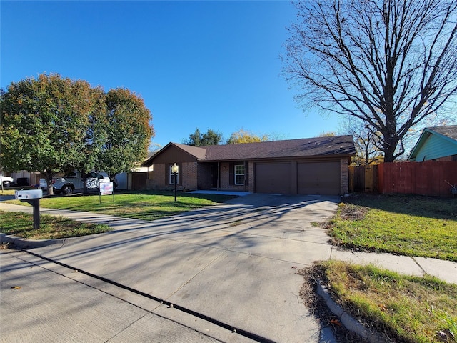 ranch-style house with a front yard and a garage