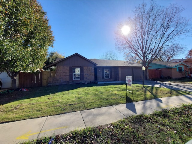 ranch-style house featuring a front lawn