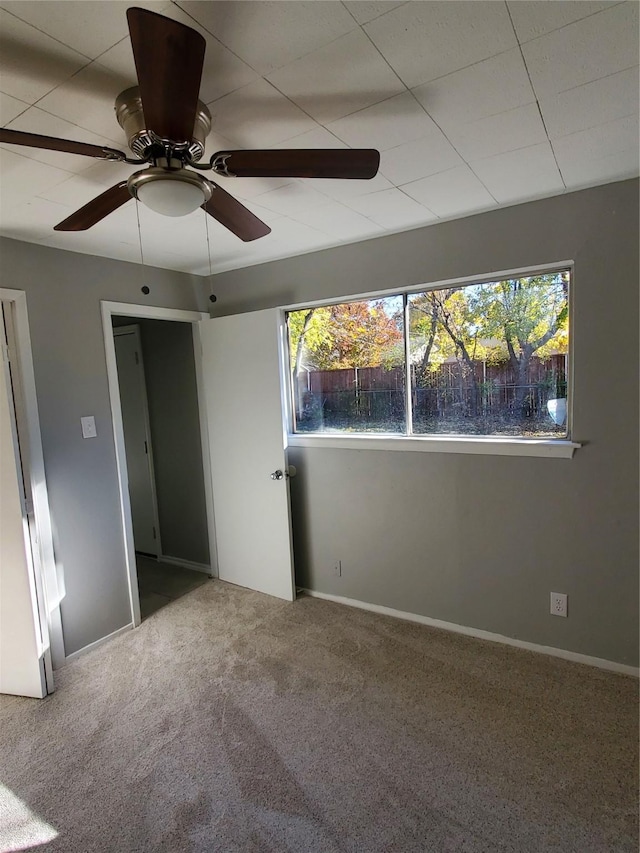 unfurnished bedroom with ceiling fan and carpet floors