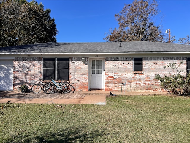 rear view of property with a yard