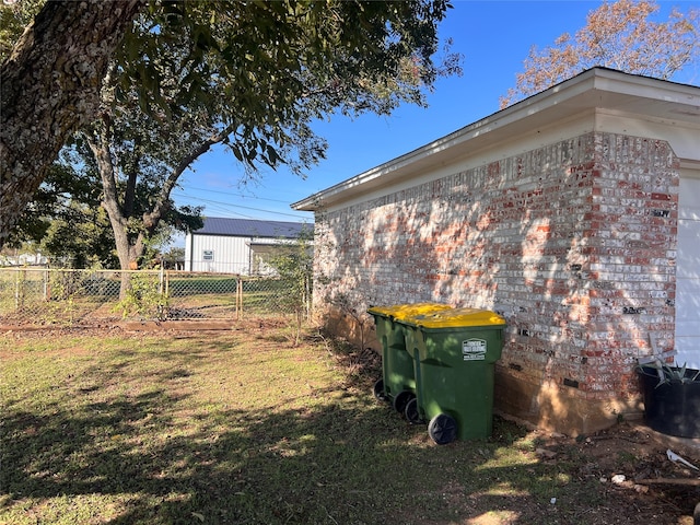 view of property exterior with a lawn