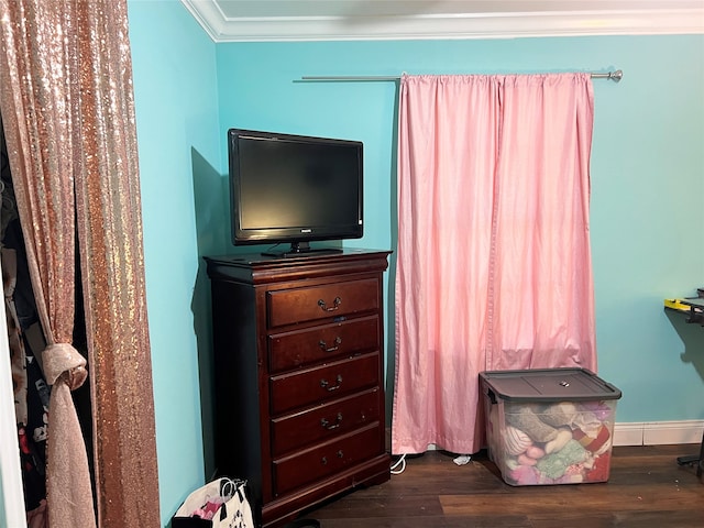 bedroom featuring dark hardwood / wood-style flooring and ornamental molding