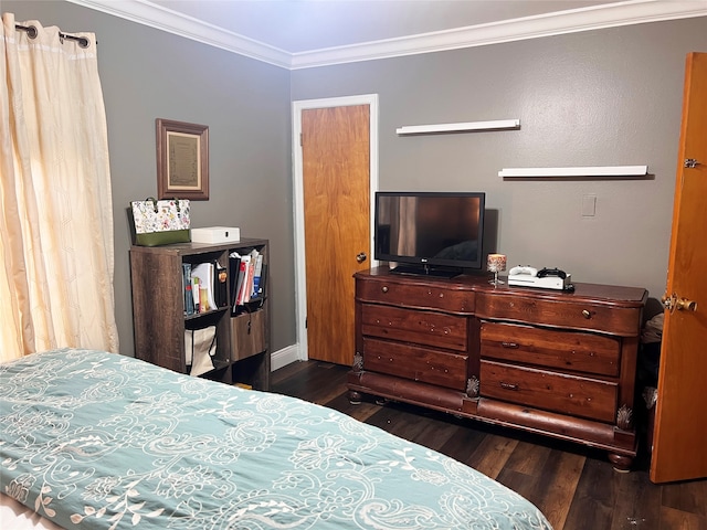 bedroom with dark hardwood / wood-style flooring and ornamental molding