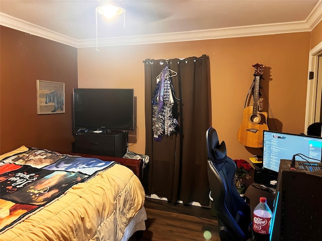 bedroom featuring dark wood-type flooring, ceiling fan, and crown molding