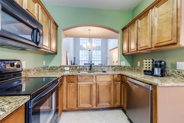 kitchen featuring sink, black appliances, light tile patterned floors, an inviting chandelier, and hanging light fixtures