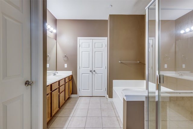 bathroom featuring tile patterned floors, vanity, and separate shower and tub