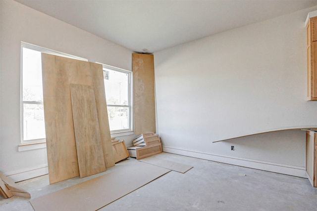 unfurnished bedroom featuring multiple windows