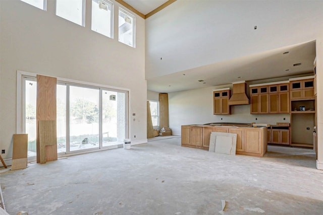 kitchen featuring premium range hood and a high ceiling