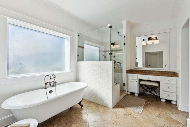 full bath with a stall shower, ornamental molding, a freestanding bath, and vanity