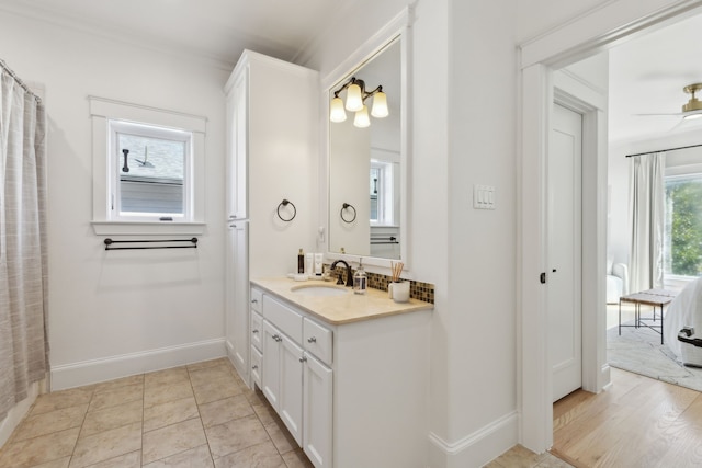 full bathroom featuring tile patterned floors, baseboards, and vanity