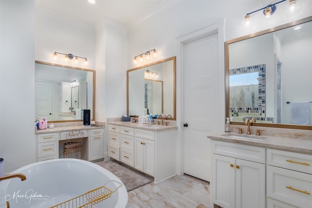 bathroom featuring a tub to relax in and vanity