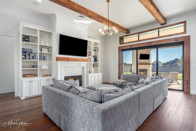 living room with beamed ceiling, ornamental molding, dark hardwood / wood-style floors, and a notable chandelier