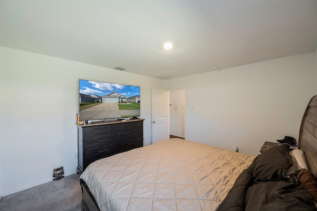 bedroom featuring light colored carpet