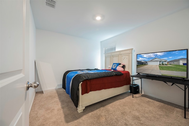 bedroom with light colored carpet