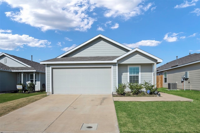 view of front of property with central AC unit, a garage, and a front lawn