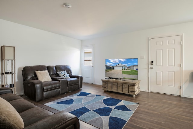 living room with dark hardwood / wood-style flooring