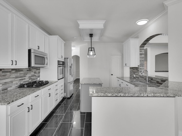 kitchen featuring kitchen peninsula, sink, white cabinets, and stainless steel appliances