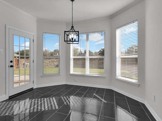 unfurnished dining area with a chandelier, plenty of natural light, and ornamental molding