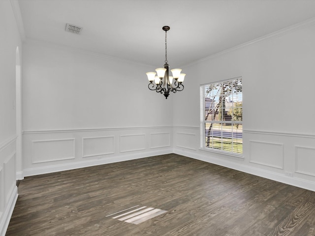 unfurnished dining area with crown molding, dark hardwood / wood-style flooring, and a notable chandelier