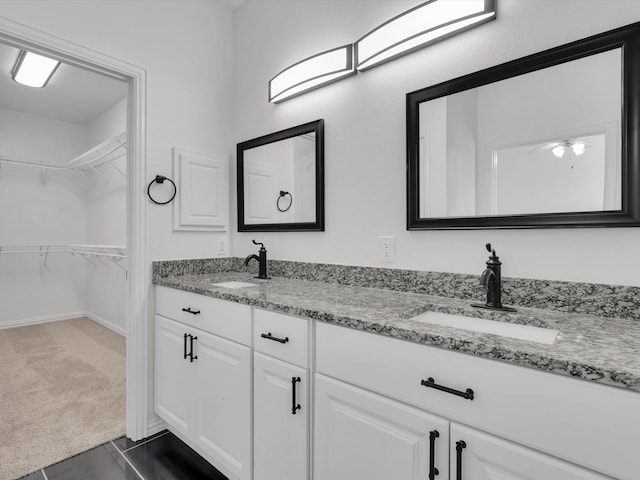 bathroom with tile patterned flooring and vanity