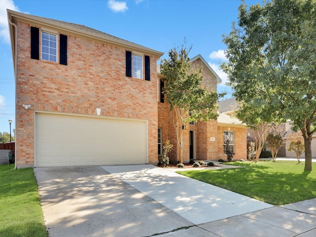 view of front of property featuring a garage and a front yard