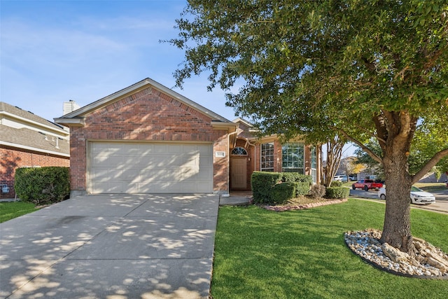 view of front of home with a front yard and a garage