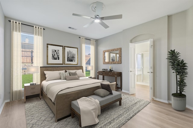 bathroom with plus walk in shower, hardwood / wood-style floors, and vanity