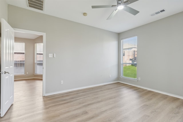 unfurnished bedroom featuring light wood-type flooring, a closet, and ceiling fan