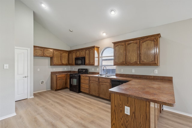 kitchen with dishwasher, ceiling fan, high vaulted ceiling, and light hardwood / wood-style flooring