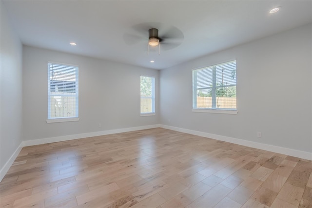 unfurnished room featuring ceiling fan and light hardwood / wood-style flooring