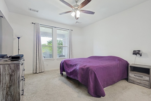 bedroom featuring ceiling fan and light colored carpet