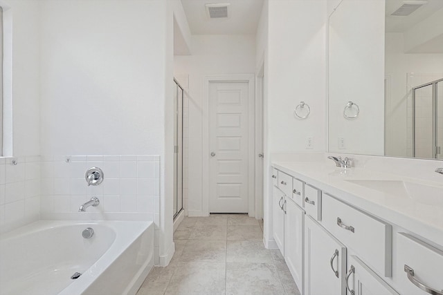 bathroom with tile patterned floors, vanity, and plus walk in shower