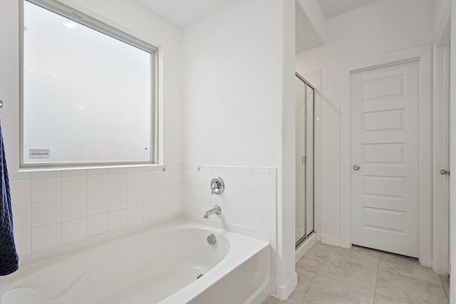 bathroom featuring tile patterned flooring, a healthy amount of sunlight, and plus walk in shower