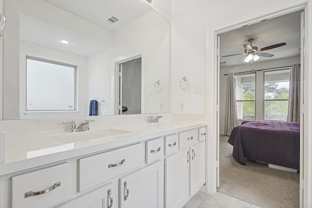 bathroom featuring vanity and ceiling fan