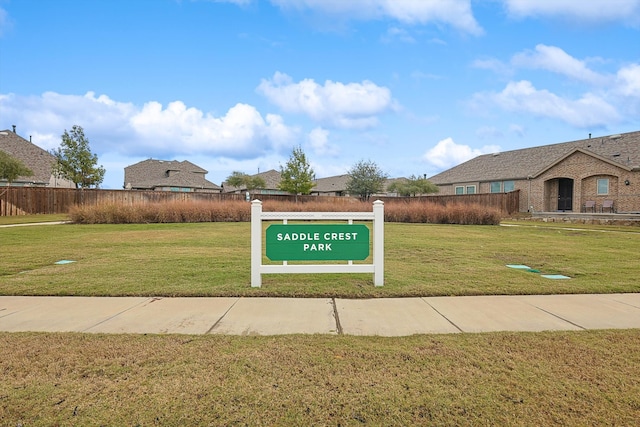 view of home's community featuring a yard