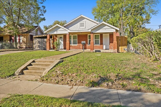 view of front facade featuring a porch and a front lawn