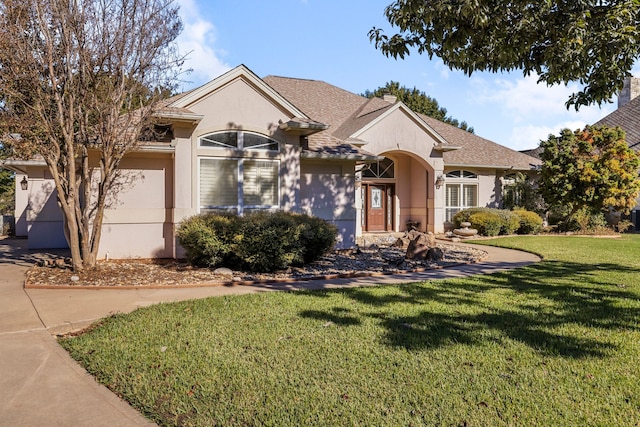 ranch-style home featuring a front lawn