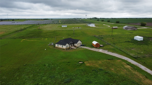 birds eye view of property with a rural view