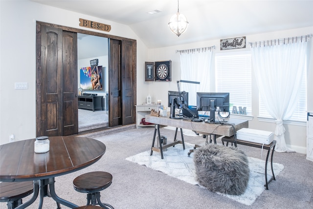 carpeted office space with lofted ceiling and a chandelier