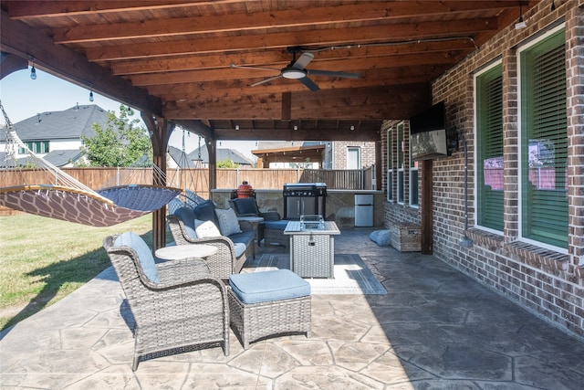 view of patio with grilling area and ceiling fan