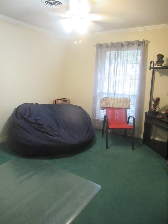 bedroom featuring ornamental molding and carpet floors