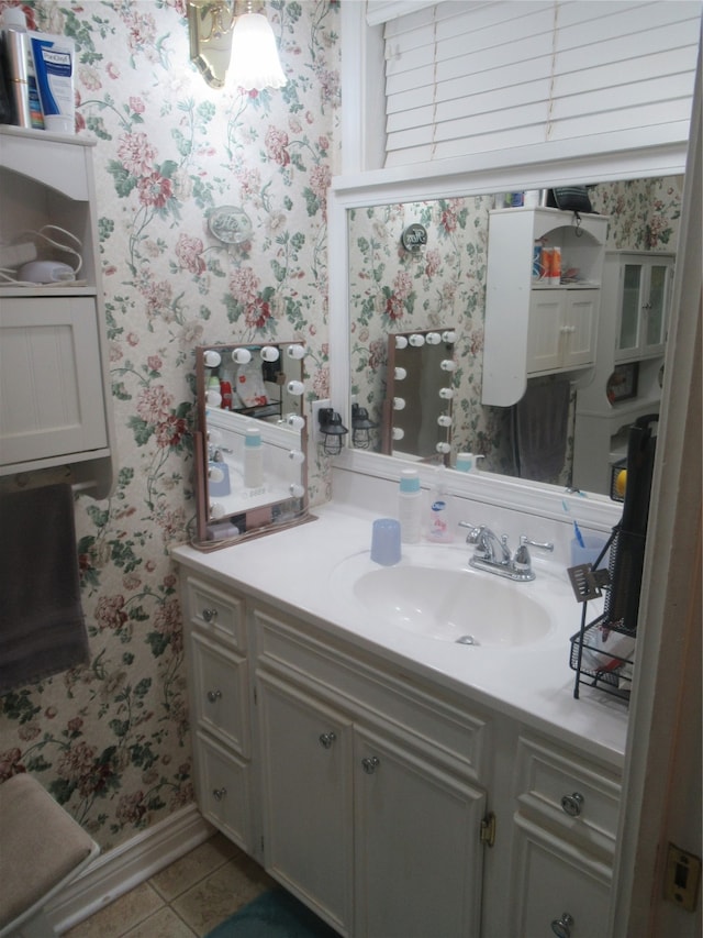 bathroom with tile patterned floors and vanity