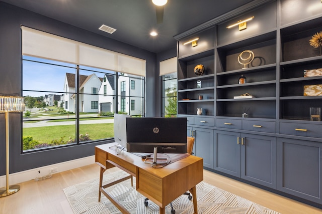 office area with light hardwood / wood-style floors