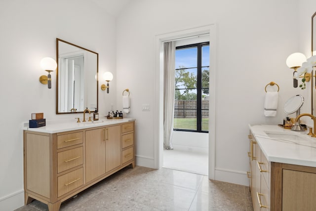 bathroom with vanity and a wealth of natural light