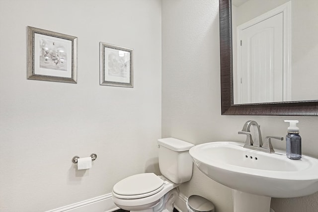 bathroom featuring sink and toilet