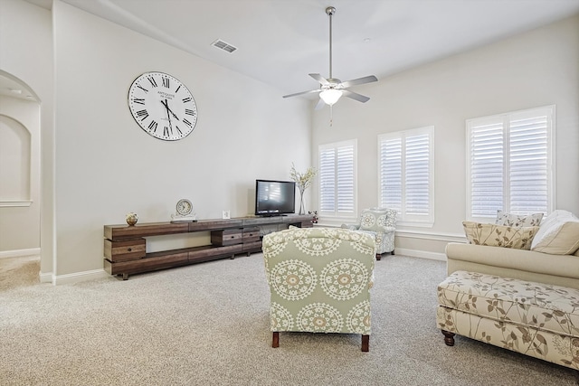 living room featuring ceiling fan and carpet floors